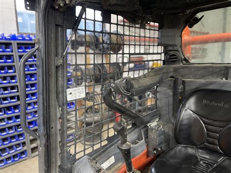 how to remove side widows on a kubota skid steer|kubota window cleaner spray.